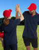 A red heavy brushed cotton cap with a curved brim and a logo on the front.