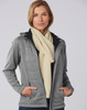 A woman wearing a grey jacket and a cream cable knit scarf, showcasing the scarf's texture and style.