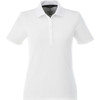 A white women's polo shirt featuring a collar and a button-down placket, with a logo present.