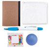 A notebook with a brown cover, a clear zip pouch, a blue pen, a pack of colorful jelly beans, and a blue stress ball.