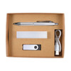 A cardboard gift set containing a silver pen, USB drive, power bank, and charging cable.