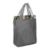 A large grey reusable tote bag with two shoulder straps, containing a drink bottle and a magazine.