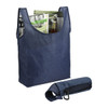 A navy blue reusable grocery tote with items inside and a compact foldable pouch attached. Features a logo.