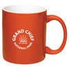An orange coffee mug with a white interior and a logo featuring mountains and rays.