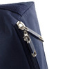 A navy blue zipper close-up on a textured fabric, featuring silver metal zipper pulls and a stitching detail.