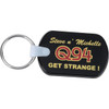 A rectangular black soft key tag with a metal ring, featuring a logo and text in bold yellow and red.