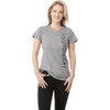 A grey short sleeve women's t-shirt featuring a logo on the side, paired with black jeans.
