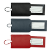 A set of pull-apart leather luggage tags in black, navy, and red, each with a clear window for information.
