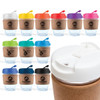 A reusable coffee cup with a cork band, featuring a variety of lid colors including white, red, pink, green, blue, and black.