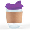 A reusable coffee cup featuring a clear glass body, a cork band, and a purple snap lid.