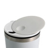 A reusable coffee cup in white with a silver band and a white lid. The lid features a drink opening.