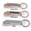 A drink bottle opener and keytag in three colors: silver, champagne, and one with an epoxy dome. Features branding.