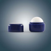 A cube-shaped lip balm in a navy blue container, featuring a removable cap and a white balm inside.