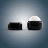 A black cube-shaped lip balm container with a removable lid, featuring a rounded white balm inside.