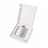 A silver hip flask is displayed inside an open white gift box, featuring a simple design and a logo.