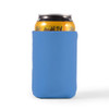 A drink can is nestled in a blue stubby cooler, designed to keep beverages cold.