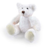 A soft, white plush teddy bear with pale yellow accents sitting with its arms and legs spread out.