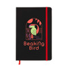 A black A5 notebook with a red elastic band, featuring a colorful bird design on the cover and a logo.