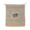 A beige mesh bag with a square pocket and a logo. It features a drawstring closure for secure storage.