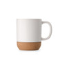 A white coffee mug with a cork base, featuring a simple design and a handle.