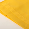 A bright yellow fabric with a smooth texture and neat folded edges, featuring stitching along the sides.