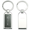 A silver keyring with a rectangular design featuring a logo area and a smooth back side.