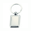 A metal keyring with a rectangular pendant, featuring a shiny silver finish. The pendant is blank and has a rounded attachment.