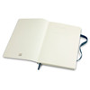 A large Moleskine classic soft cover notebook with a plain interior and a blue ribbon bookmark.
