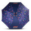 A full-colour umbrella featuring a vibrant pattern of purple, pink, and orange on a dark background. It has a logo printed on it.