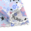 A microfibre cleaning cloth featuring a colourful pattern with pink, blue, and black designs, including hearts and stars.