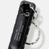 A black rechargeable torch keyring featuring a metal attachment for convenience and a USB charging port.