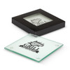A square glass coaster, clear with a black base and branding, displayed in a black box.
