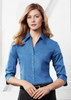 A women's button-up shirt in a vibrant blue colour with 3/4 sleeves and a fitted style, featuring a logo.