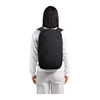 A black Bellroy Via Backpack 20L is worn on the back of a person in casual attire, showcasing its sleek design.