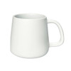 A coffee mug in white with a minimalist design and a rounded shape, featuring a simple handle and no visible branding.