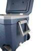 A navy blue rolling cooler box with a grey lid, featuring wheels, a handle, and an attached lid strap.