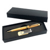 A wooden pen and metal USB drive displayed in a black gift box, featuring a sleek design and an elegant finish.