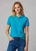 A woman wearing a vibrant teal short sleeve polo shirt, featuring a collar and buttons, paired with jeans.