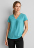 A teal women's blouse with a V-neck and pleat detail, featuring short sleeves and a relaxed fit.