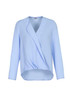 A light blue women's hi-lo blouse with a wrap design and long sleeves, featuring a soft fabric finish.