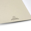 A soft cover notebook in a natural beige colour with lined pages and a logo indicating it's made from recycled paper.