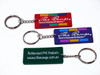 A set of three custom PVC keyrings in red, purple, and green, featuring a metal chain and keyring attachment.