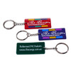 A set of three custom PVC keyrings in red, blue, and green, each with a metal keyring attachment and branding.