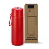 A drink bottle in bright red with a lid and a carry strap, alongside a brown box featuring a logo.