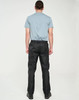 Lightweight black nylon waterproof rain pants displayed on a person from the back, wearing a grey T-shirt.