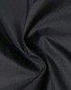 A close-up of lightweight nylon fabric in black, showing a smooth, waterproof texture. There is a logo visible.