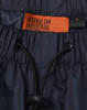 Navy lightweight nylon waterproof rain pants with an adjustable drawstring waistband and branding label.