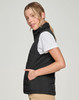 A black insulated puffer vest with a 3D cut, featuring a zip pocket and a sleek design.