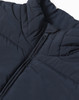 A dark navy insulated puffer vest with a high collar and zipper, featuring a fabric texture and stitching details.