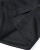 A close-up of a black men's jacquard knit polo, highlighting the textured fabric and stitching details.